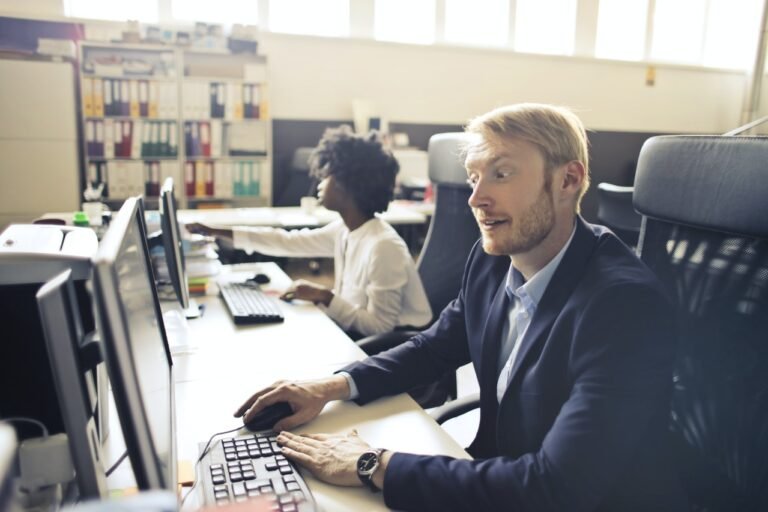 man in suit using the computer